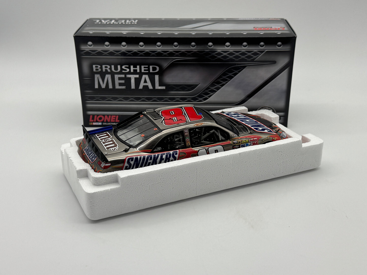 Item J830 - Kyle Busch #18 Snicker's 2011 Camry Brushed Metal **Din 5**