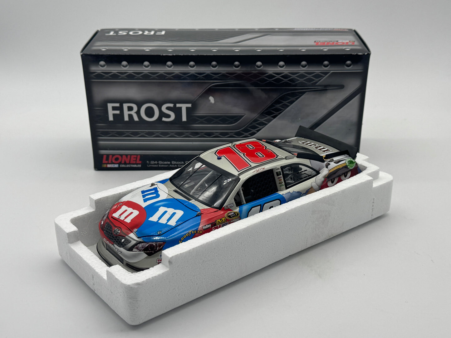 B - Item J902 - Kyle Busch #18 M&M's Red, White & Blue 2012 Camry Frost