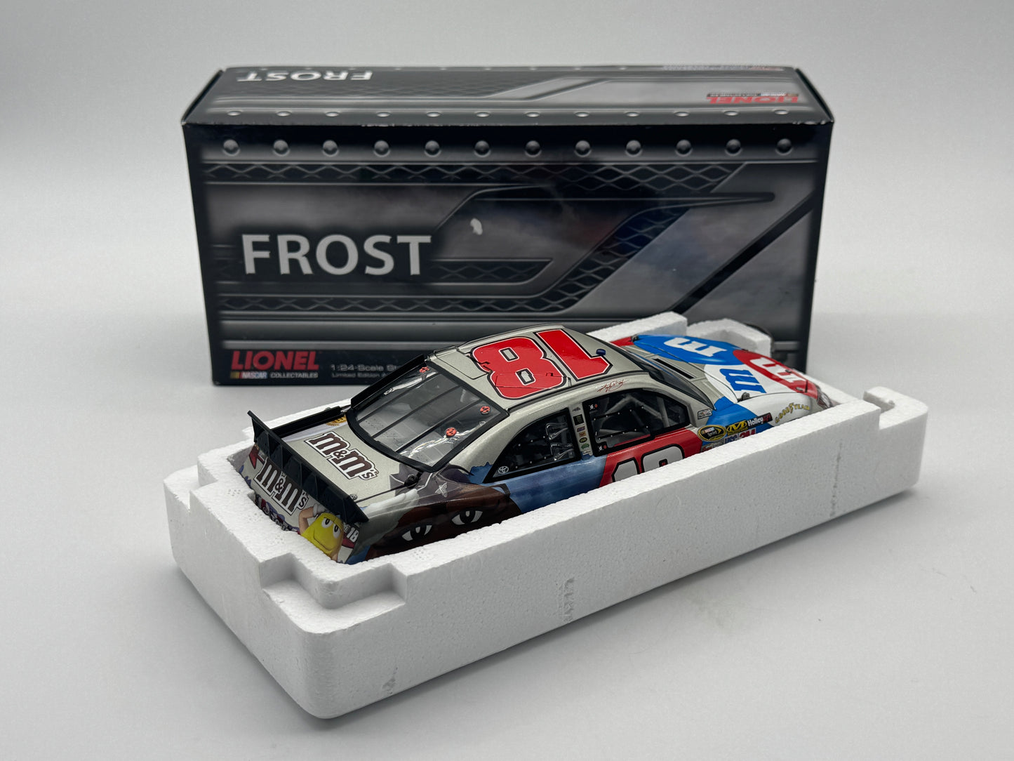 B - Item J902 - Kyle Busch #18 M&M's Red, White & Blue 2012 Camry Frost