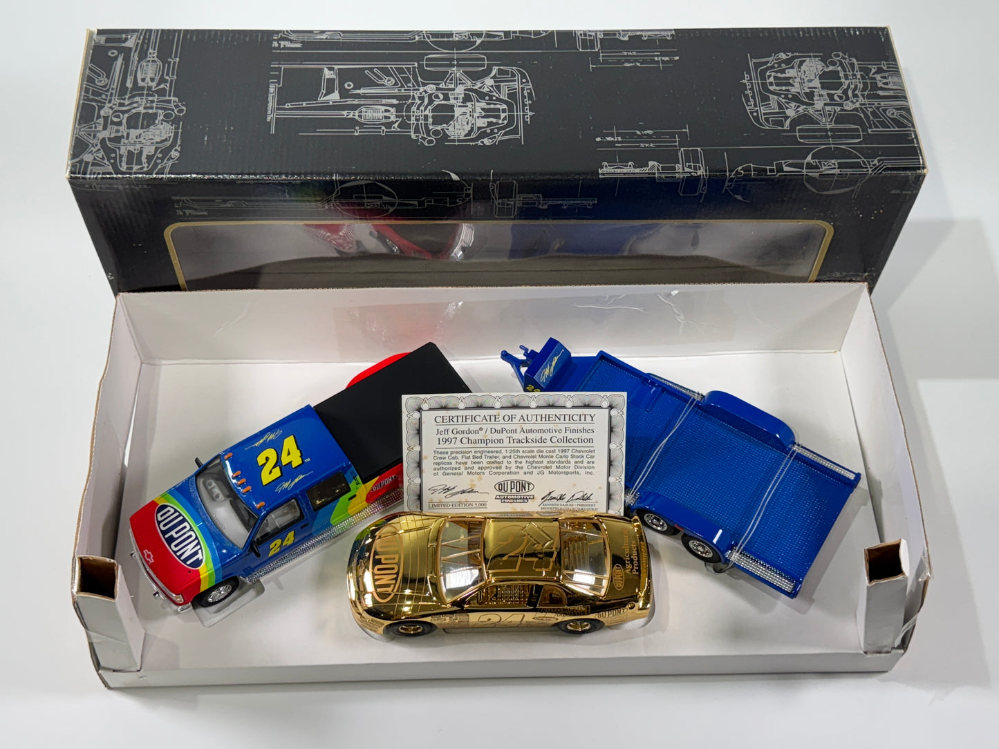 Item H709 - Jeff Gordon #24 Championship Trackside Collection Gold **box dmg**