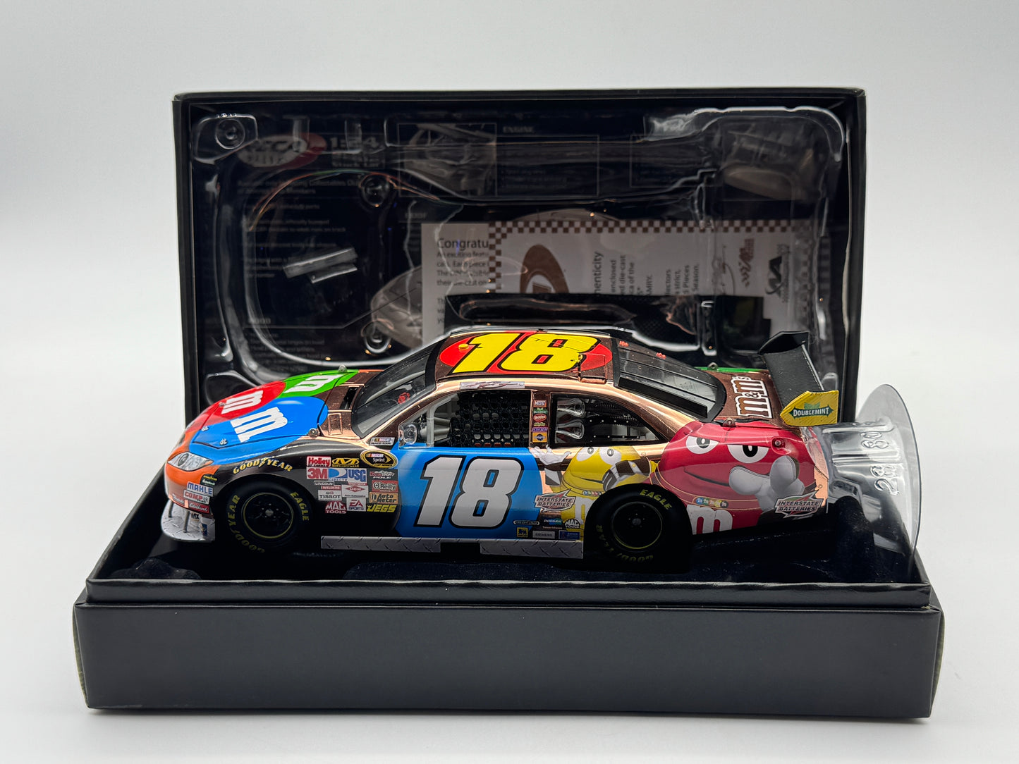 Item J806 - Kyle Busch #18 M&M's 2010 Camry Copper Elite