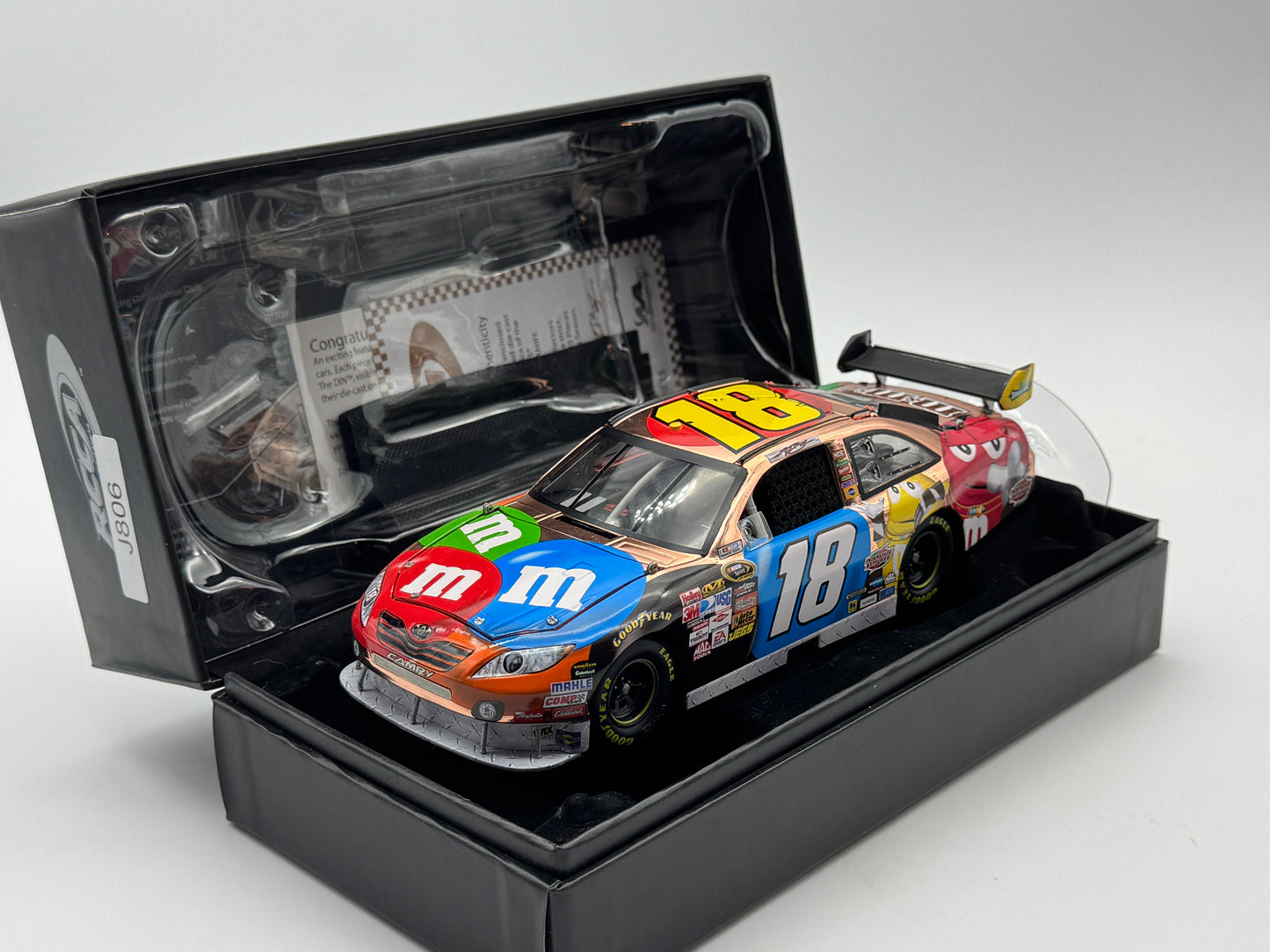 Item J806 - Kyle Busch #18 M&M's 2010 Camry Copper Elite
